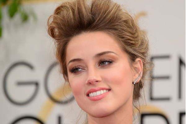 Amber donaraacute 7 millones de doacutelares de su divorcio 