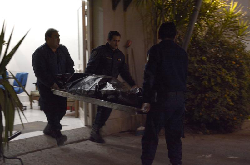 AUTOPSIA El cuerpo fue llevado a la morgue para ser examinado por el forense